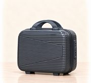 A three-piece pink luggage set consisting of a large spinner suitcase, a medium spinner suitcase, and a matching small handbag, all with telescoping handles and wheels, shown on a light beige background. 