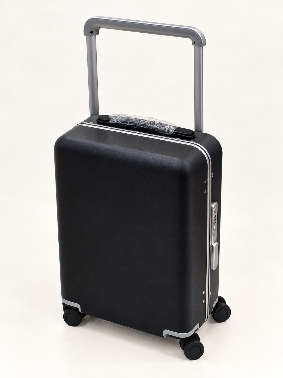 A black hard-shell carry-on suitcase with a silver telescoping handle and four spinner wheels, shown on a clean white background.
