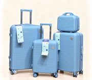 A three-piece pink luggage set consisting of a large spinner suitcase, a medium spinner suitcase, and a matching small handbag, all with telescoping handles and wheels, shown on a light beige background. 