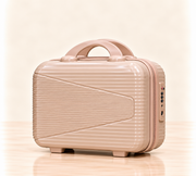 A three-piece pink luggage set consisting of a large spinner suitcase, a medium spinner suitcase, and a matching small handbag, all with telescoping handles and wheels, shown on a light beige background. 